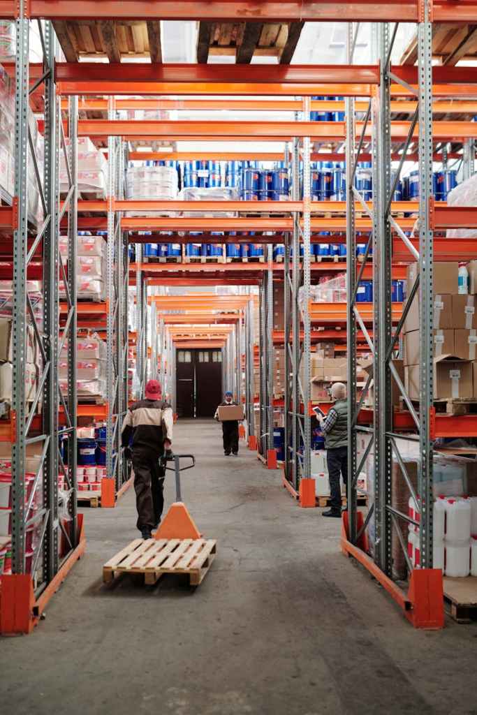 men working in factory warehouse